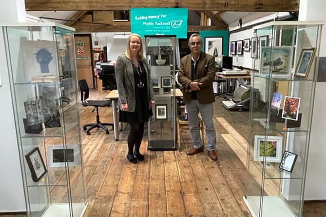 Phyllis Tuckwell community fundraiser Jenny Newman with Kiln Photo’s Abb Abbas-Nazari