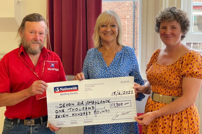 John Groves, left, receiving a cheque for £1,700 from CODS president Carolyn Stoyle, centre, and Heather Barlow, right.  AQ 9783
