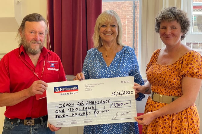 John Groves, left, receiving a cheque for £1,700 from CODS president Carolyn Stoyle, centre, and Heather Barlow, right. AQ 9783