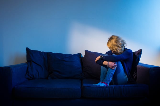 PICTURE POSED BY A MODEL Undated photo of a woman sitting on a sofa. Three specialist rape courts are to be set up in England as part of a pilot scheme designed to improve dismal conviction rates for serious sexual offences. Issue date: Thursday June 16, 2022.