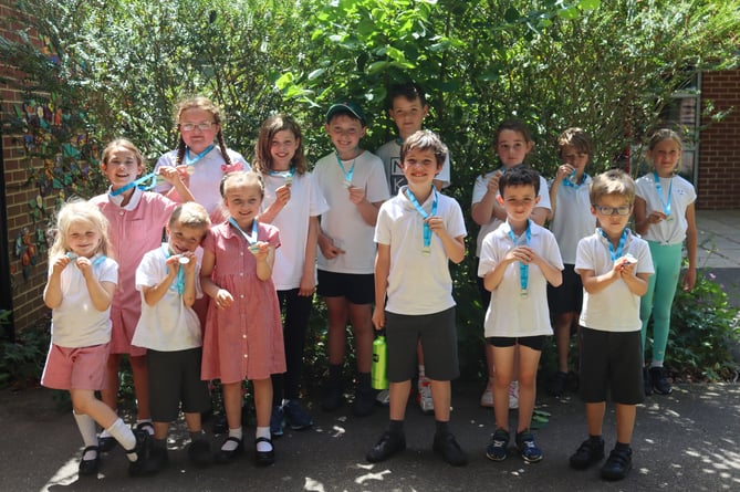 All pupils and staff at Greatham Primary School took part in the Cancer Research UK Race For Life 2022, walking or running a mile in PE to raise more than £600.