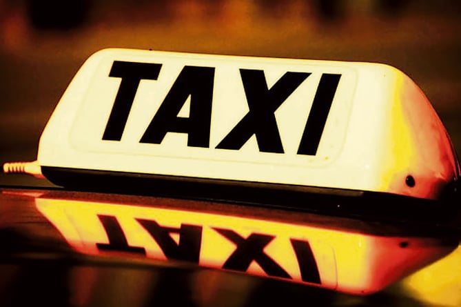 close up on a yellow taxi cab sign