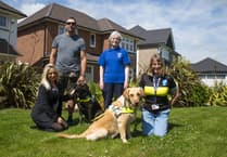Housebuilder donates £500 to help Guide Dogs group on Okehampton