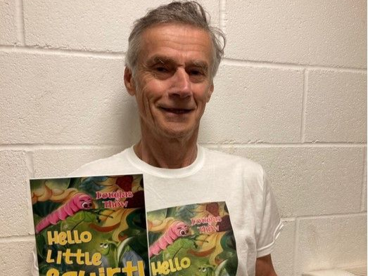 Hindhead author Douglas Thow pictured with a copy of his book