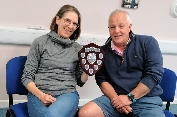 Crediton Swimming Club Secretary Karen Paddon receiving the Chairman’s Trophy from Chairman Paul Saunders. Photo: Peter Brewer