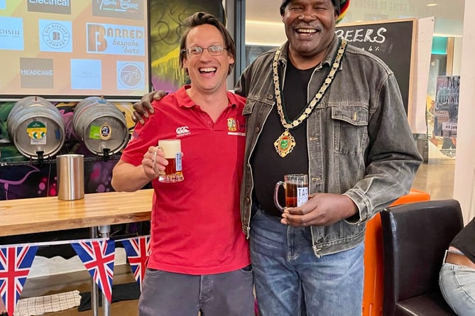 Whitehill Town Mayor Cllr Leeroy Scott enjoys the first pint of the Bordon beer and cider festival at the Tap@The Shed with Tap@The Shed owner Edward Spice on June 24th 2022.
