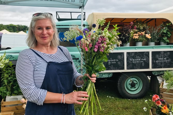 Lyn Shaw with organic grown flowers on the Amelia's Flower Farm stand - organic flower farm at Combeinteignhead