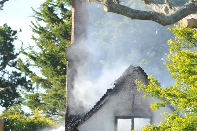 Firefighters at the scene of the thatched property blaze in Strete Raleigh ©StevePope/MDA