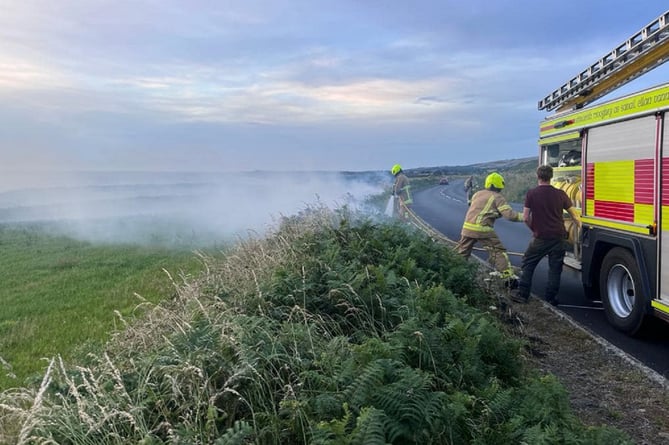 Fire crews deal with hedge fire near Kirk Michael