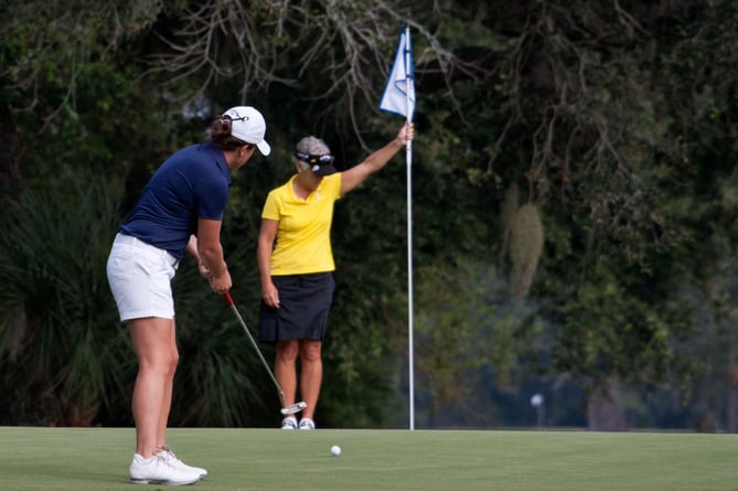 general shot of women playing golf