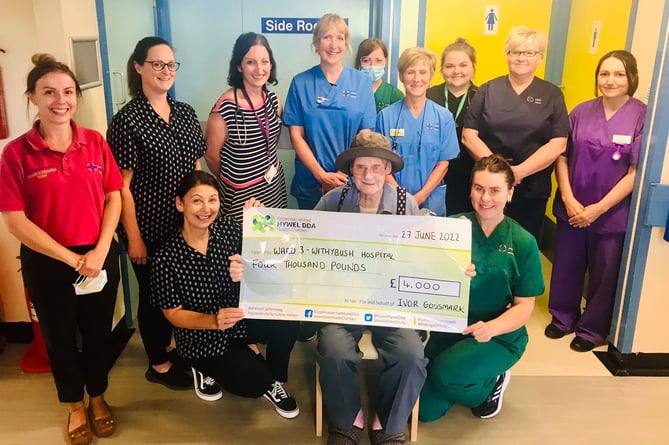 Patient Ivor Godsmark presents a cheque for £4,000 to Ward 3 staff at Withybush Hospital, Haverfordwest