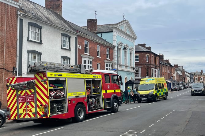 Emergency services at the scene in Crediton High Street.  AQ 1975