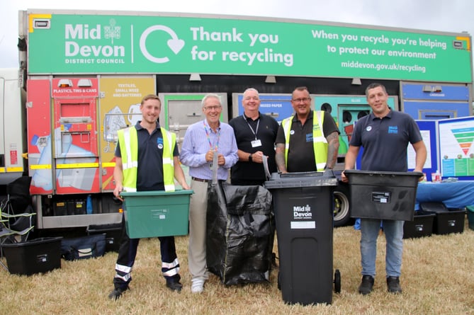 Members of Mid Devon Recycling Team with, second left, Cllr Colin Slade, MDDC cabinet member for the environment and climate change with the seagull sack and new bin, centre, at the recent Mid Devon Show. AQ 7560