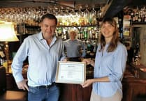  MP Mel Stride presents food hygiene certificate to Ukrainian refugee