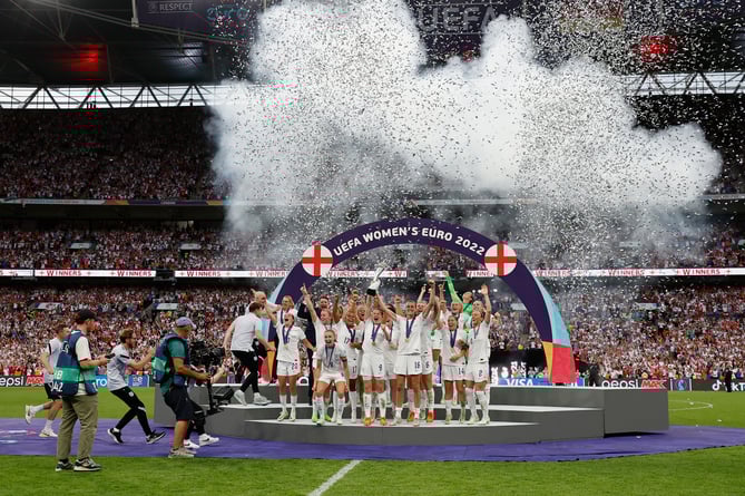 LONDON, ENGLAND - JULY 31: Leah Williamson and Millie Bright of England lift the UEFA Womenâs EURO 2022 Trophy after their sides victory during the UEFA Women's Euro 2022 final match between England and Germany at Wembley Stadium on July 31, 2022 in London, England. (Photo by Lynne Cameron - The FA/The FA via Getty Images)