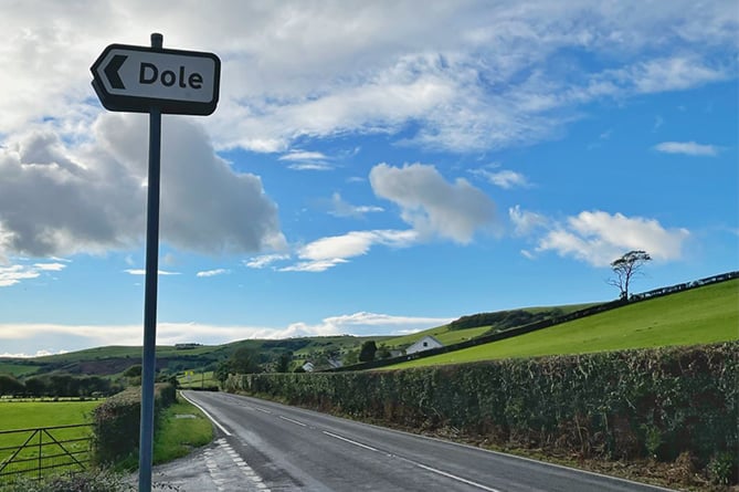 A road sign to Dole