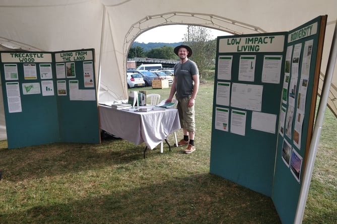 Paul Trotter with a display explaining the One Planet development at the Monmouth Climate Future Festival
